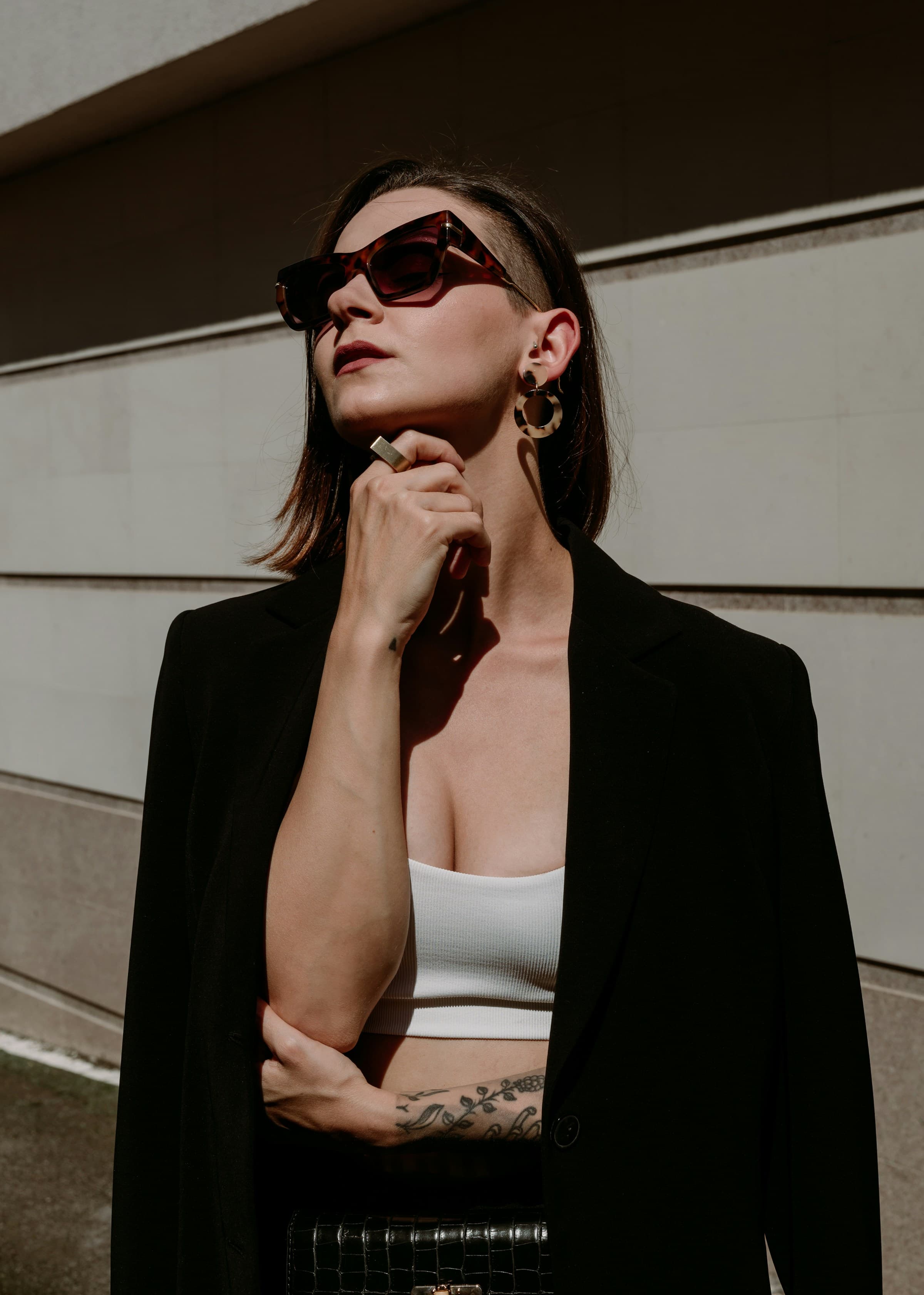 Campaign model in a white top and black tailored blazer