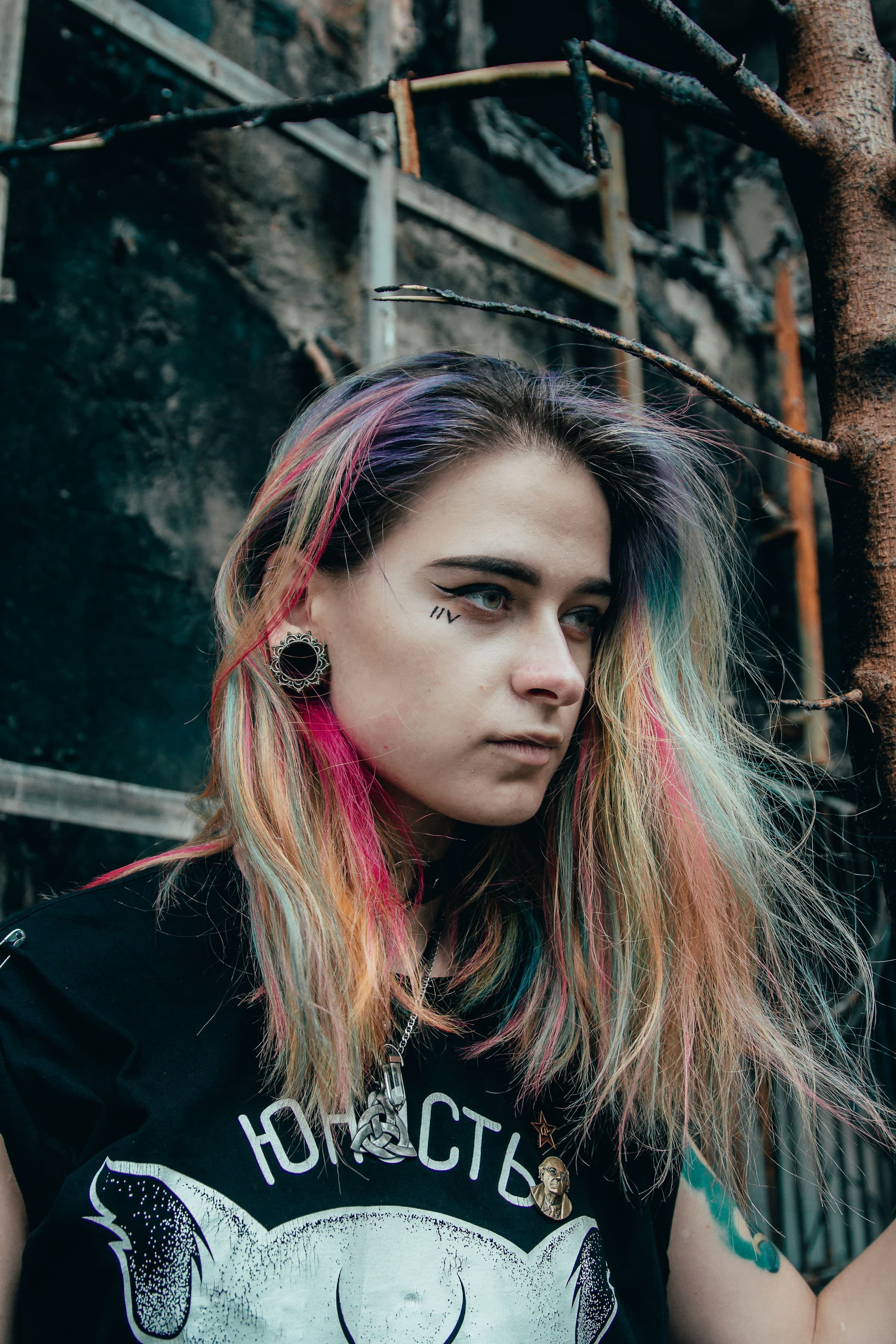 Close portrait in a plain black crew-neck top