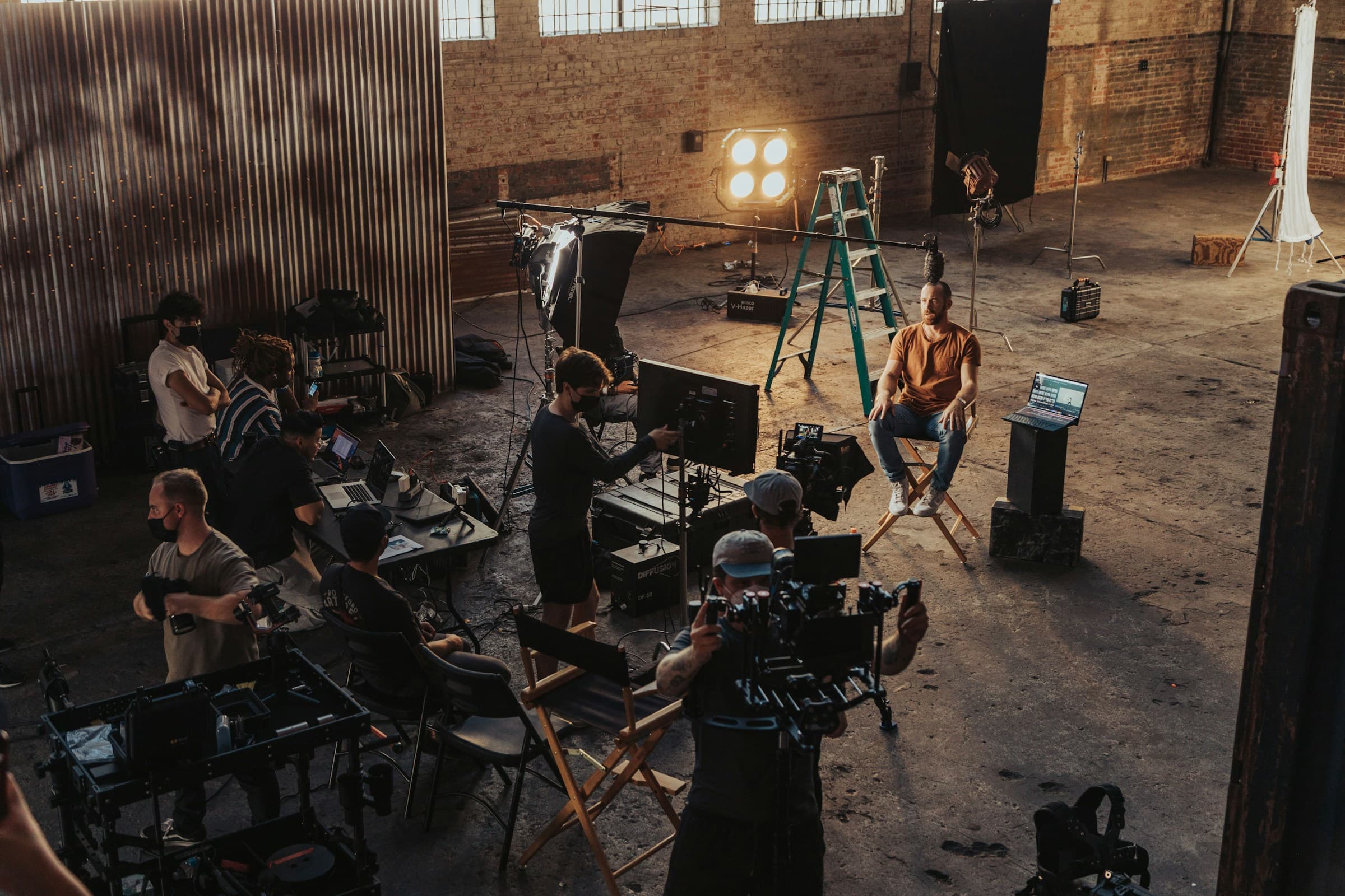 Crew gathered around a camera rig part-way through a shoot