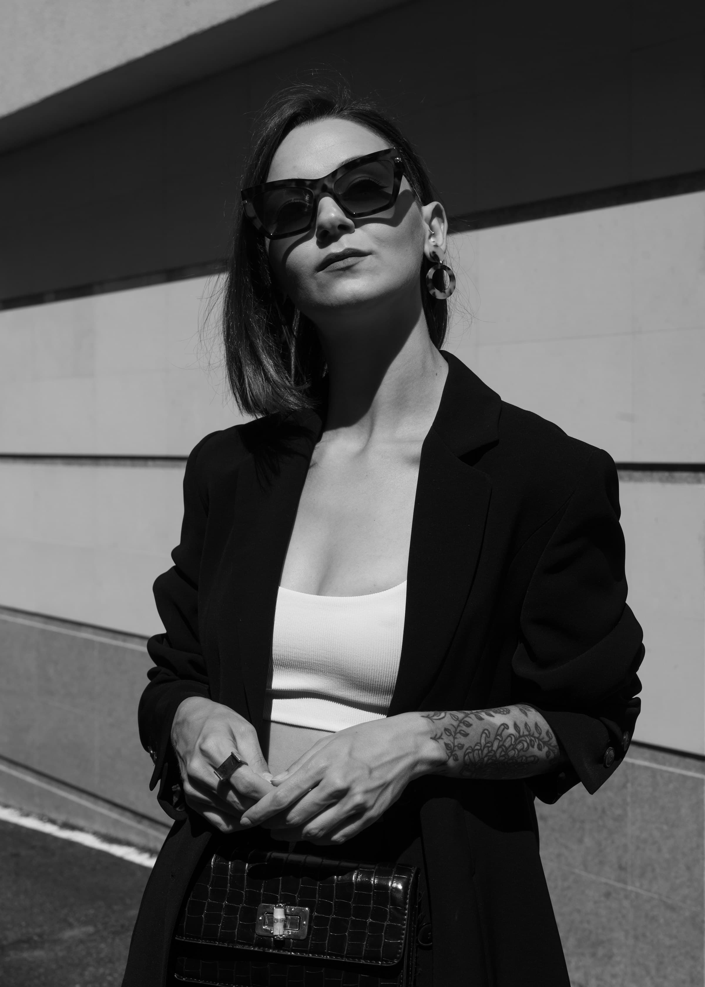 Close portrait of a woman in dark sunglasses and a leather jacket